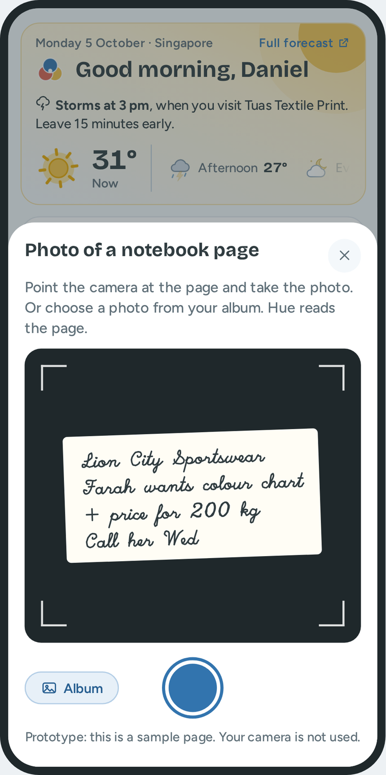 Photo of a notebook page on a phone: the camera view with a page of handwriting.